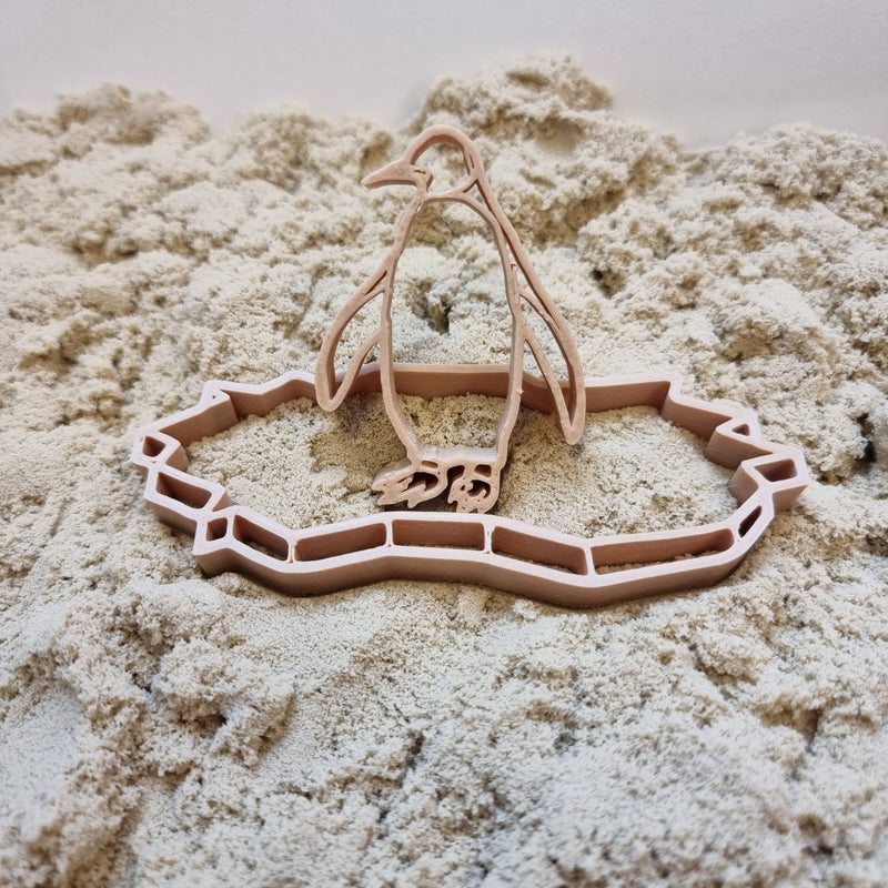 Grennn pinguïn en ijsschots uitsteker